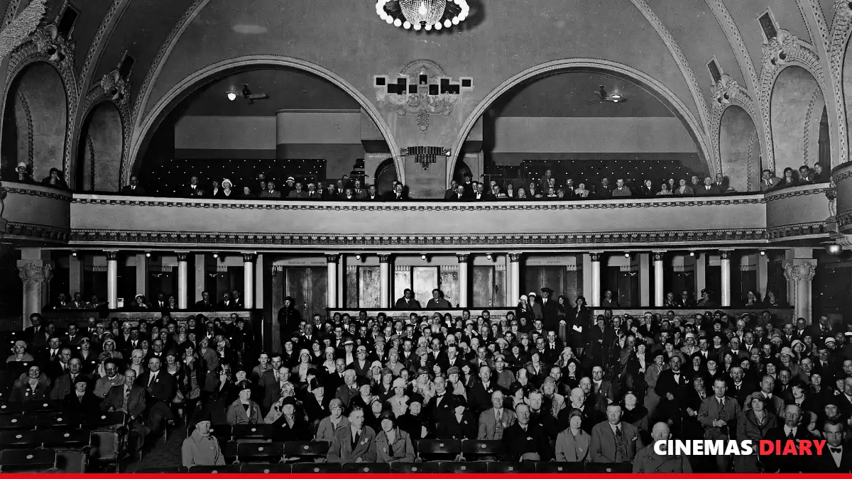 Audience enjoying Malayalam comedy movies in a theatre